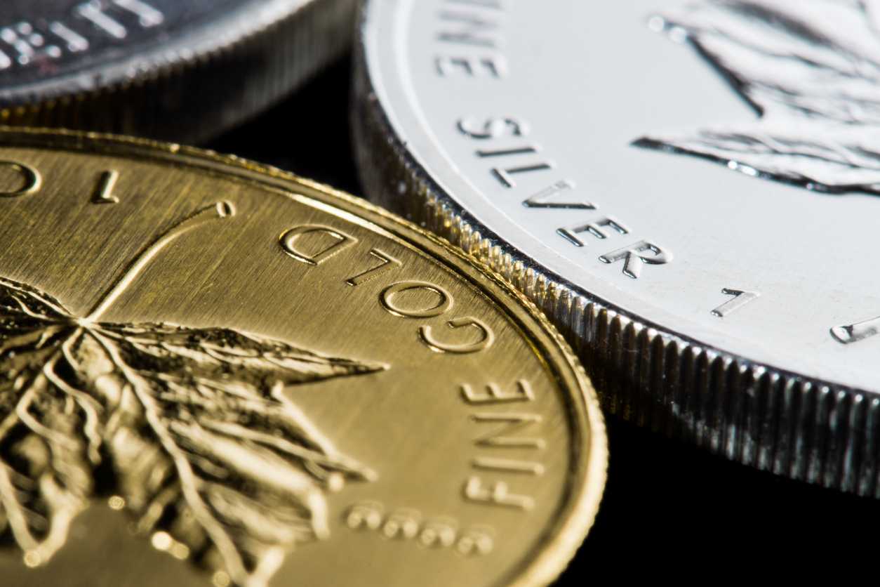 Gold eases on firmer dollar ahead of Fed decision